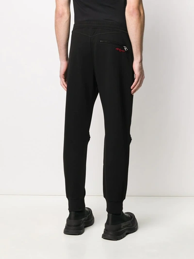 Shop Alexander Mcqueen Embroidered Logo Patch Track Trousers In Black