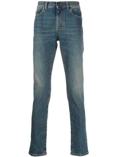Shop Saint Laurent Faded-effect Blue Jeans