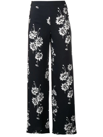 Shop Mcq By Alexander Mcqueen Floral Printed Trousers In Black