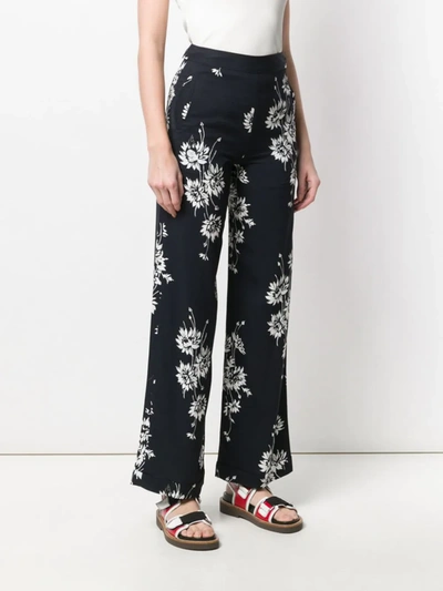 Shop Mcq By Alexander Mcqueen Floral Printed Trousers In Black