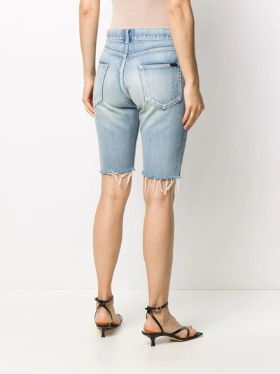 Shop Saint Laurent Frayed-edge Denim Shorts In Blue