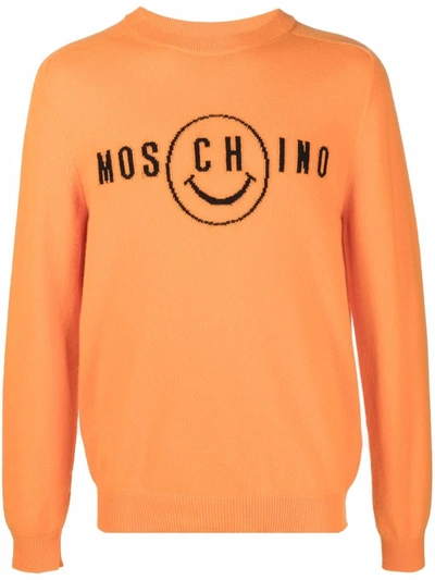 Shop Moschino Smiley Face Logo Jumper In 橘色