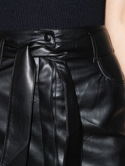 Shop Nanushka Faux-leather Mini Skirt In Black