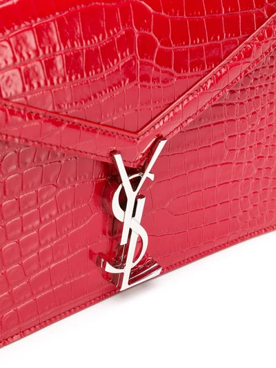 Shop Saint Laurent Cassandra Embossed Crossbody Bag In Red