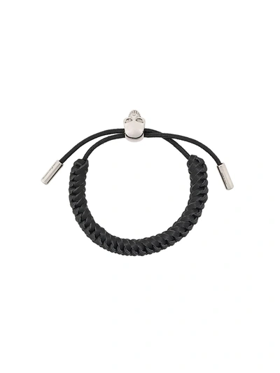 Shop Alexander Mcqueen Woven Skull Bracelet In Black