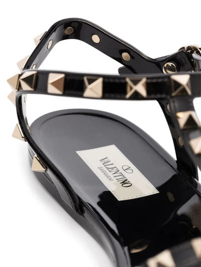 Shop Valentino Rockstud Flat Sandals In Black