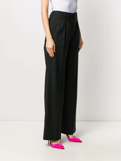 Shop Loulou Flared Wool Trousers In Black