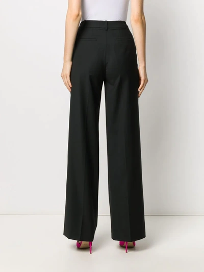 Shop Loulou Flared Wool Trousers In Black