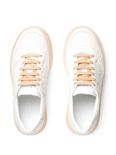 Shop Gucci Gg Embossed Low-top Sneakers In White