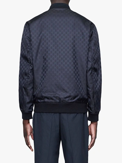 Shop Gucci Gg Pattern Reversible Bomber In Blue