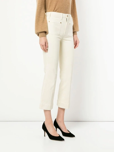 Shop Khaite Raquel Cropped Flare Jeans In Neutrals