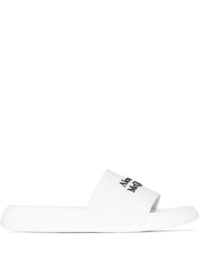 Shop Alexander Mcqueen Logo-embossed Slides In White
