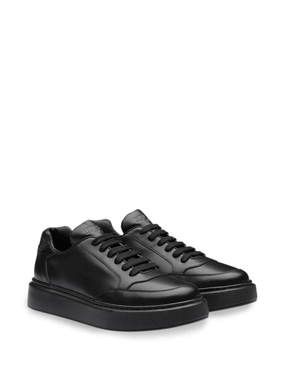 Shop Prada Logo Low-top Sneakers In Black