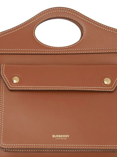 Shop Burberry Mini Topstitch Detail Leather Pocket Bag In Brown