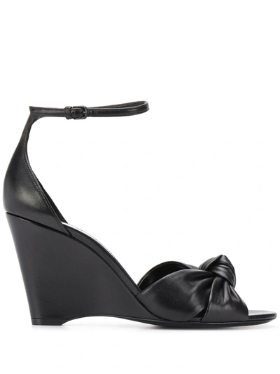 Shop Saint Laurent Knot Detail Wedge Sandals In Black