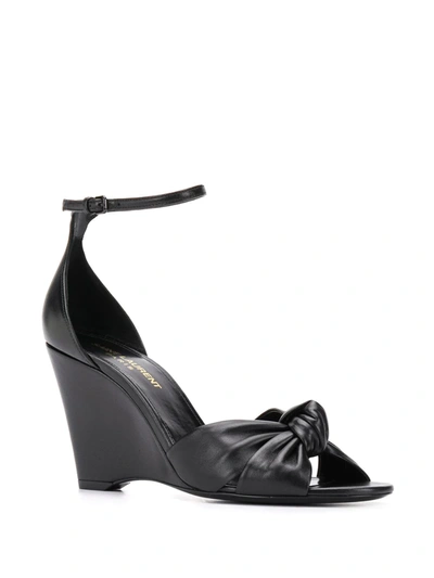 Shop Saint Laurent Knot Detail Wedge Sandals In Black