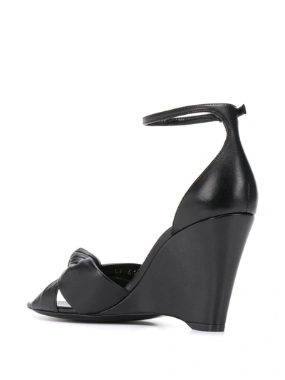 Shop Saint Laurent Knot Detail Wedge Sandals In Black