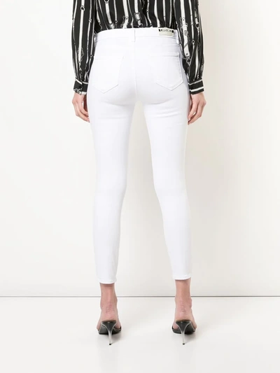 Shop L Agence Cropped Skinny Jeans In White