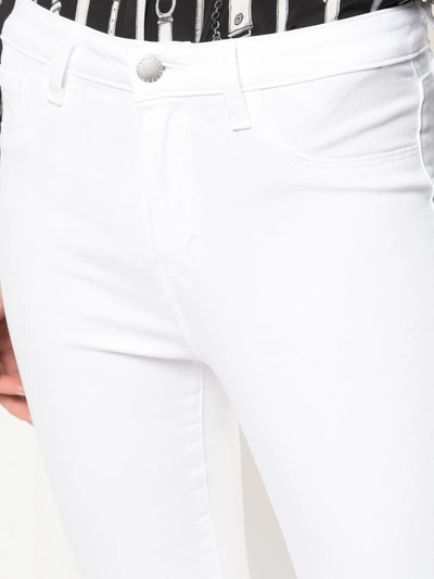 Shop L Agence Cropped Skinny Jeans In White