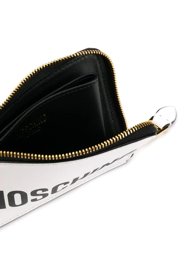 Shop Moschino Logo Zipped Wallet In White