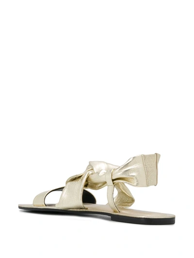 Shop Pollini Bow Detail Flat Sandals In Gold