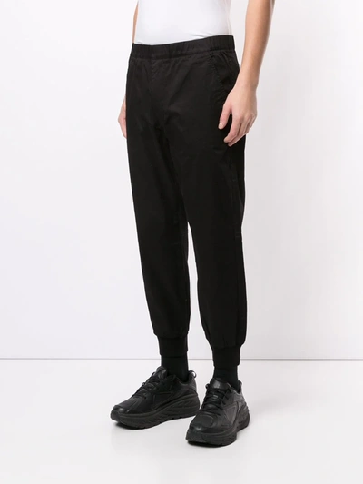 Shop Aape By A Bathing Ape Tapered Cut Elasticated Trousers In Black