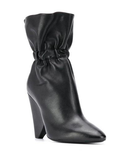 Shop Saint Laurent Elasticated Detail Ankle Boots In Black