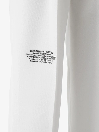 Shop Burberry Location Print Trousers In White