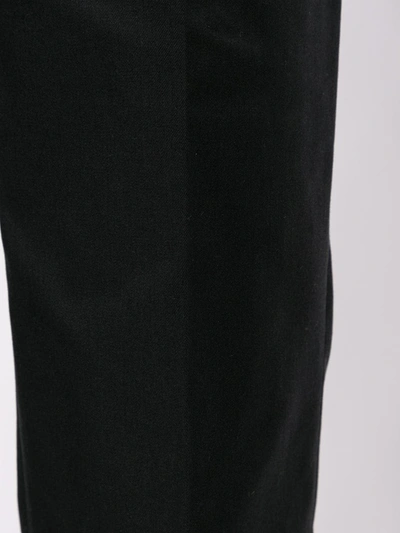 Shop Msgm Pleated Cuffed Trousers In Black
