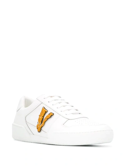 Shop Versace Ilus Virtus Sneakers In White