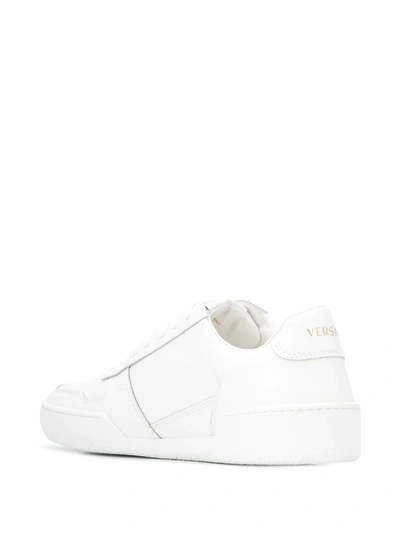 Shop Versace Ilus Virtus Sneakers In White