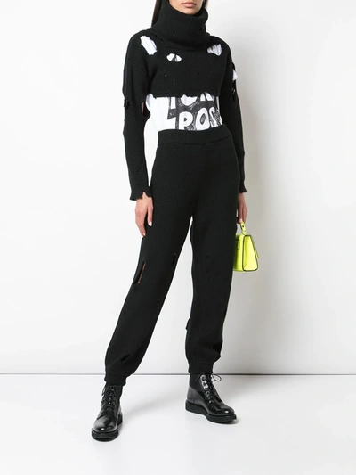 Shop Jeremy Scott Destroyed Knitted Track Pants In Black