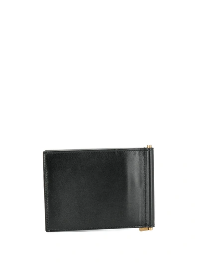 Shop Saint Laurent Monogram Money Clip Wallet In Black