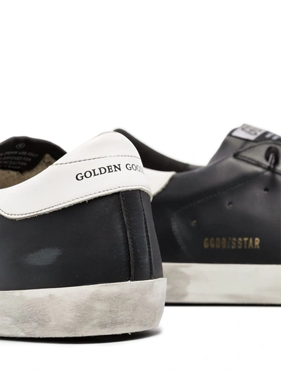 Shop Golden Goose Super-star Distressed-effect Sneakers In Black