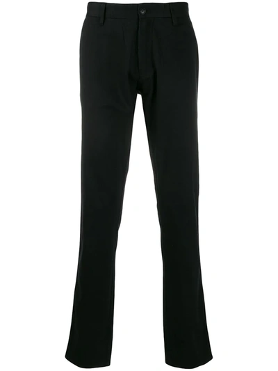 Shop Emporio Armani Slim-fit Logo Plaque Trousers In Black