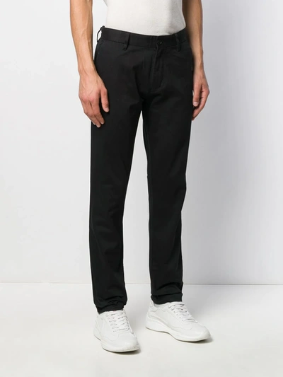 Shop Emporio Armani Slim-fit Logo Plaque Trousers In Black