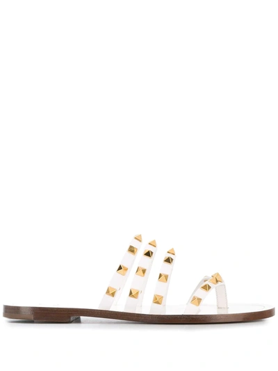 Shop Valentino Rockstud Flat Sandals In White