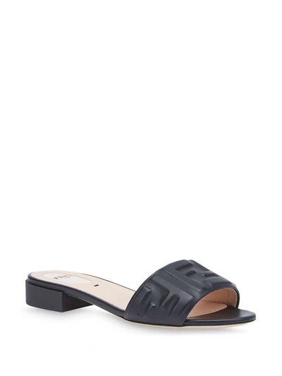 Shop Fendi Embossed Ff-motif Slip-on Sandals In Black