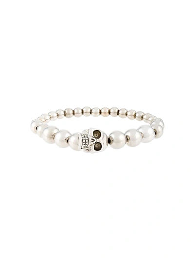 Shop Alexander Mcqueen Beaded Skull Bracelet In Metallic