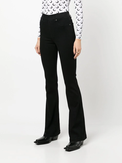 Shop Spanx High-rise Flared Jeans In Black