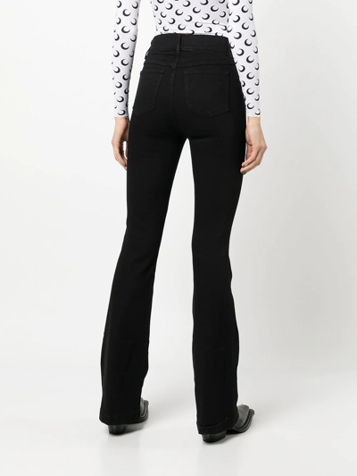 Shop Spanx High-rise Flared Jeans In Black