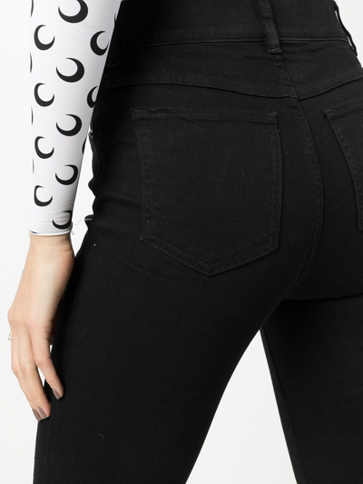 Shop Spanx High-rise Flared Jeans In Black