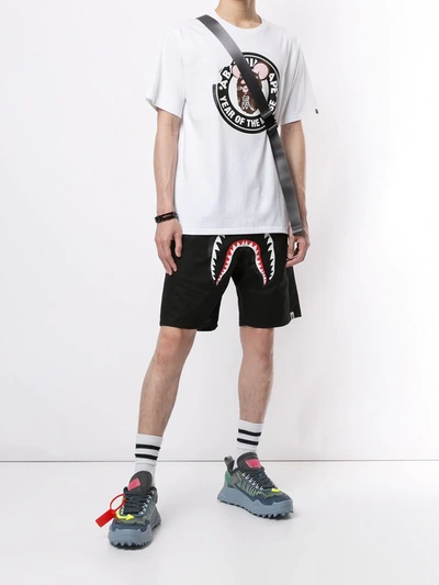 Shop A Bathing Ape Graphic Print Track Shorts In Black