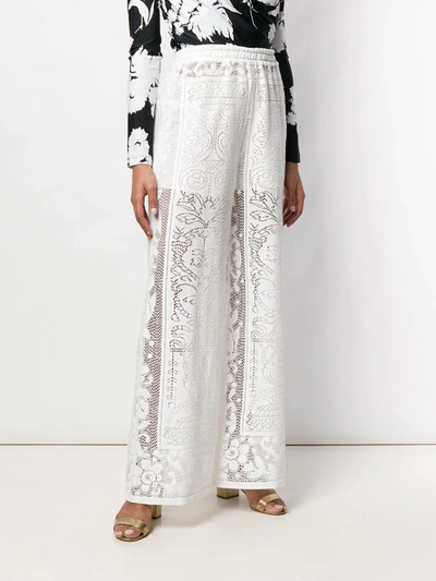 Shop Dolce & Gabbana Crochet Palazzo Pants In White