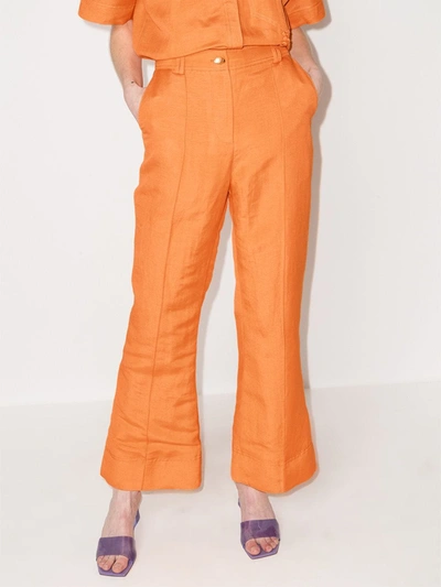 Shop Aje Cantina Flared Trousers In Orange