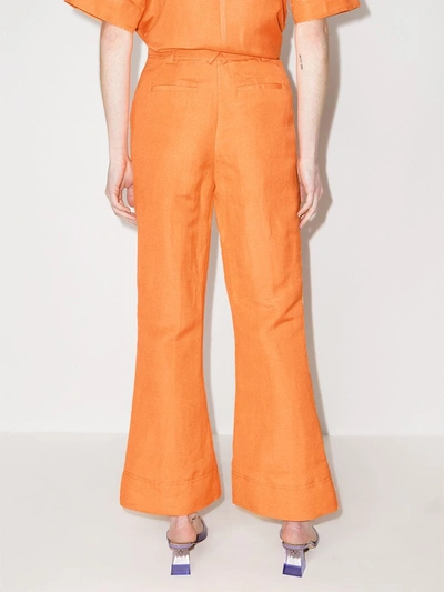 Shop Aje Cantina Flared Trousers In Orange