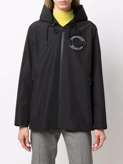 Shop Burberry Hooded Logo Patch Jacket In Schwarz