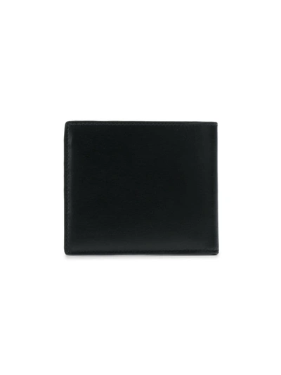 Shop Saint Laurent East/west Leather Wallet In Black