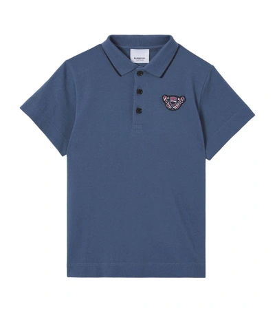 Shop Burberry Kids Thomas Bear Polo Shirt (8-14 Years) In Blue