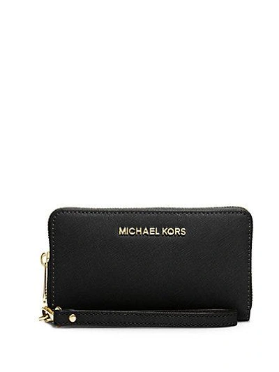 Shop Michael Michael Kors Saffiano Leather Wristlet In Black